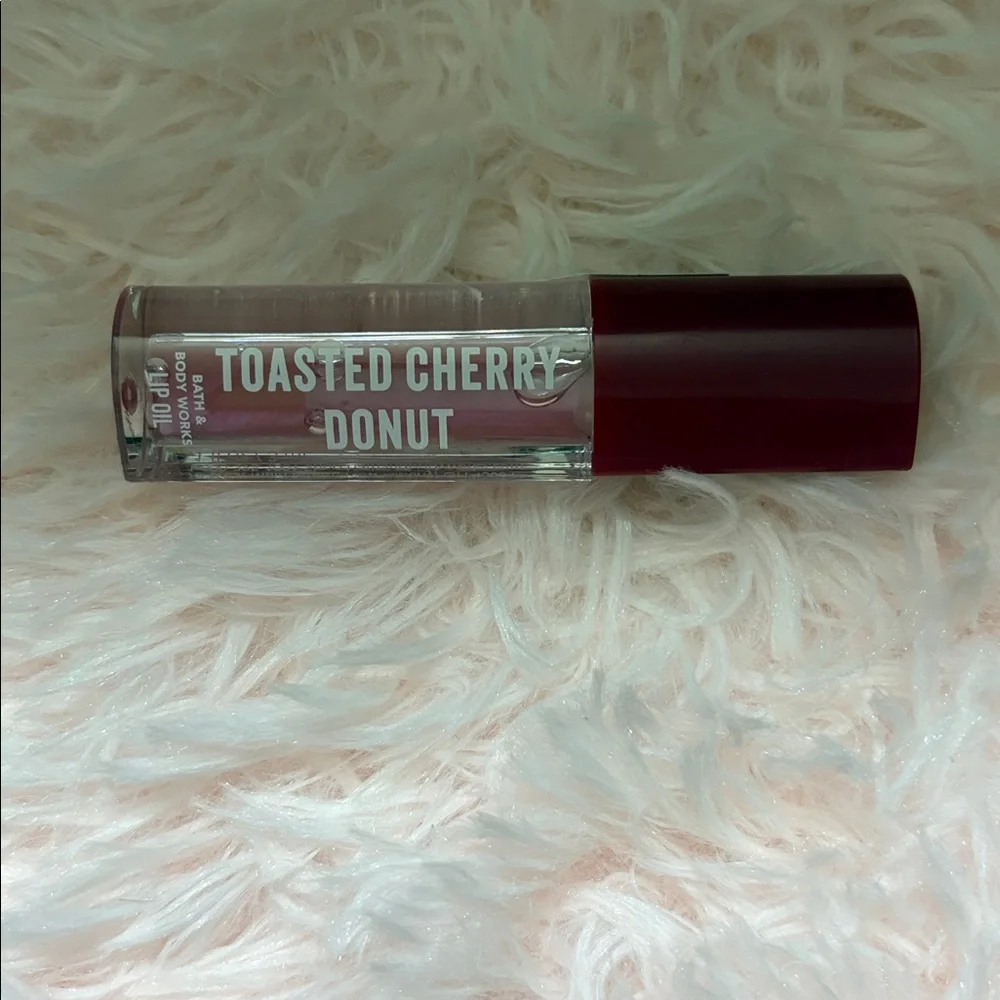 Price FIRM New Bath Body Works Toasted Cherry Doughnut Lip Oil